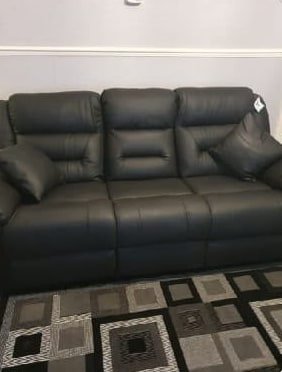 Norma's black leather 3 seater recliner at home